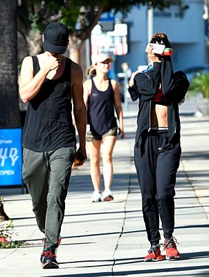 Vanessa Hudgens shows her muscular abs as she hides her face after a workout with Austin Butler Featuring: Vanessa Hudgens Where: Los Angeles, Califor...-stock-photo